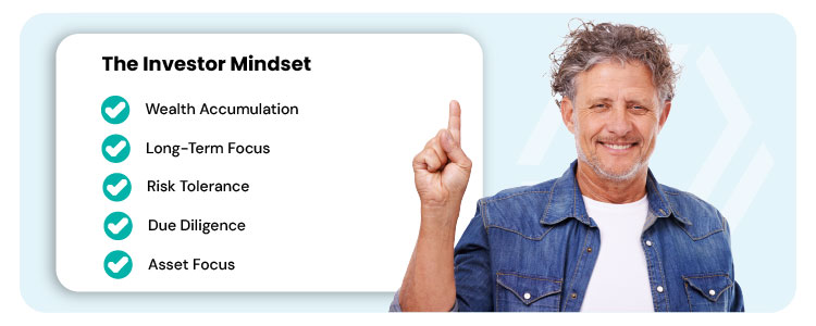 A smiling older man in a denim shirt points upward with one finger, symbolizing focus and strategy. On the left, a white text box titled “The Investor Mindset” lists five points with green check icons: Wealth Accumulation, Long-Term Focus, Risk Tolerance, Due Diligence, Asset Focus.